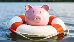 Piggy bank floating in life preserver